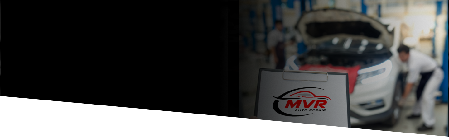 Mechanics working on car